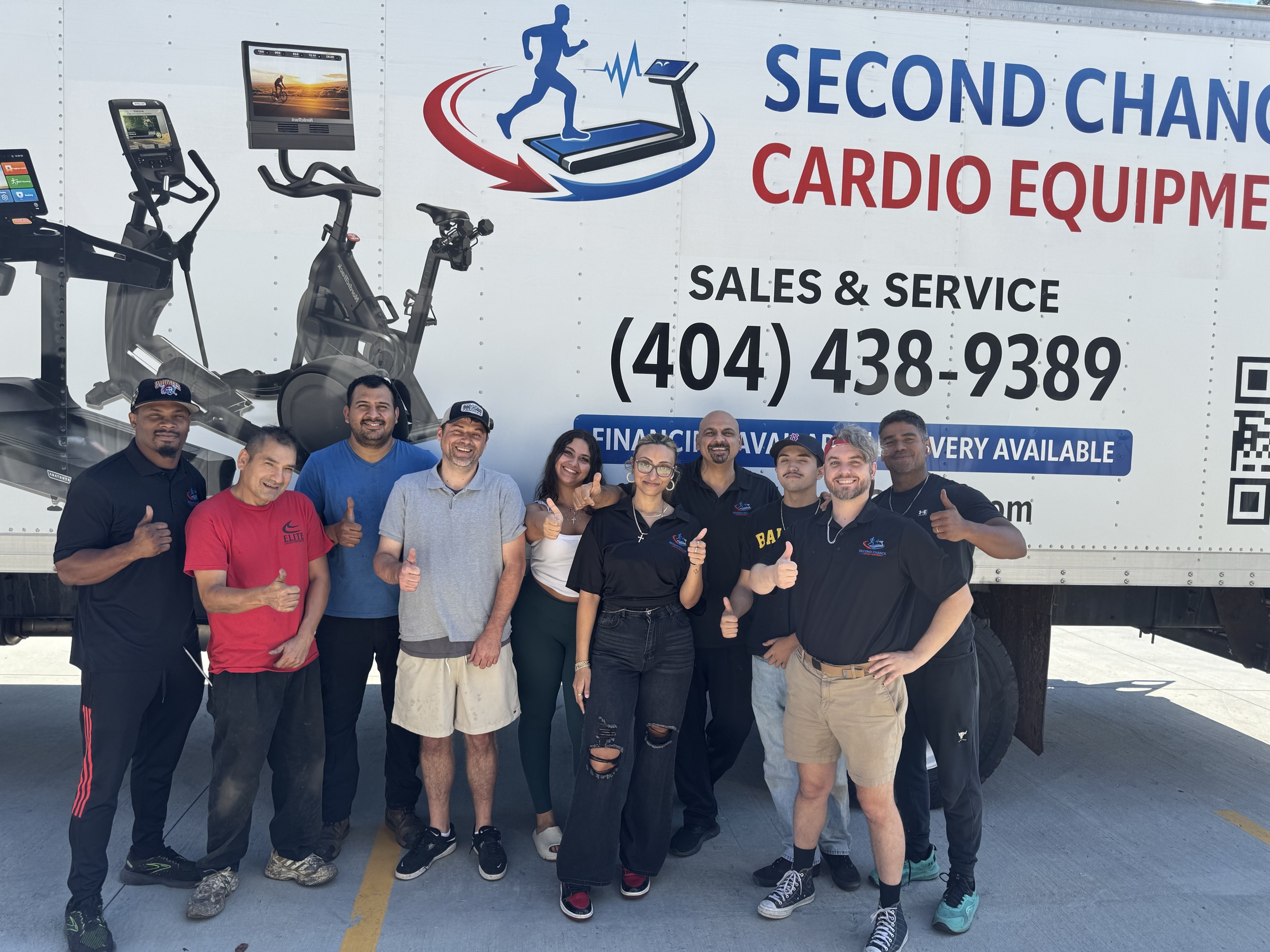 Second Chance Cardio team in front of the branded delivery truck